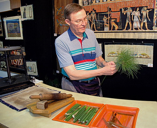 Ferrell Jenkins shows how papyrus plants are cut to make writing mateial.