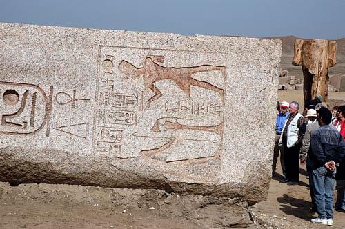 Group views large stones with Hieroglyphs at Tania, Egypt. Photo by Ferrell Jenkins.